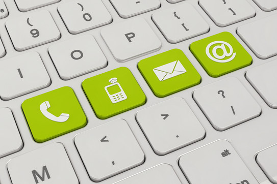 contact A white keyboard with four green keys. On the green keys are symbols like a telephone, a cell phone, an envelope and an „@“